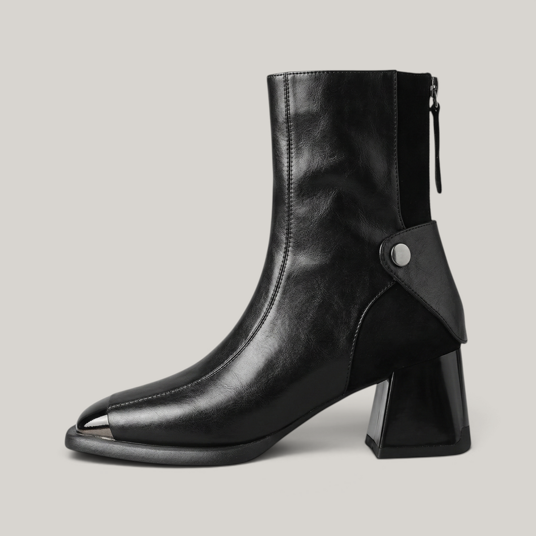 USS® Shoes Valenne black cowhide leather ankle boots with a square toe, metal detail, and sculpted block heel.