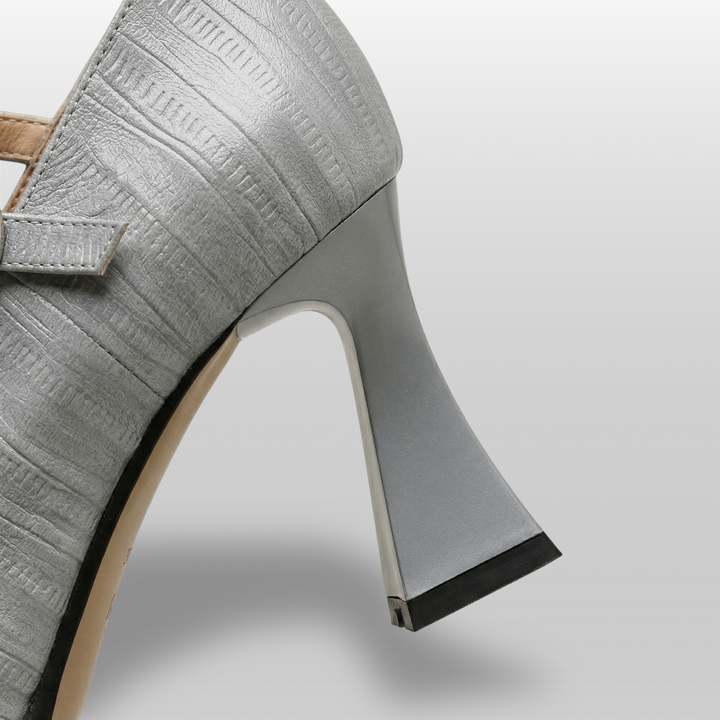 Gray high-heeled shoe on a light gray background