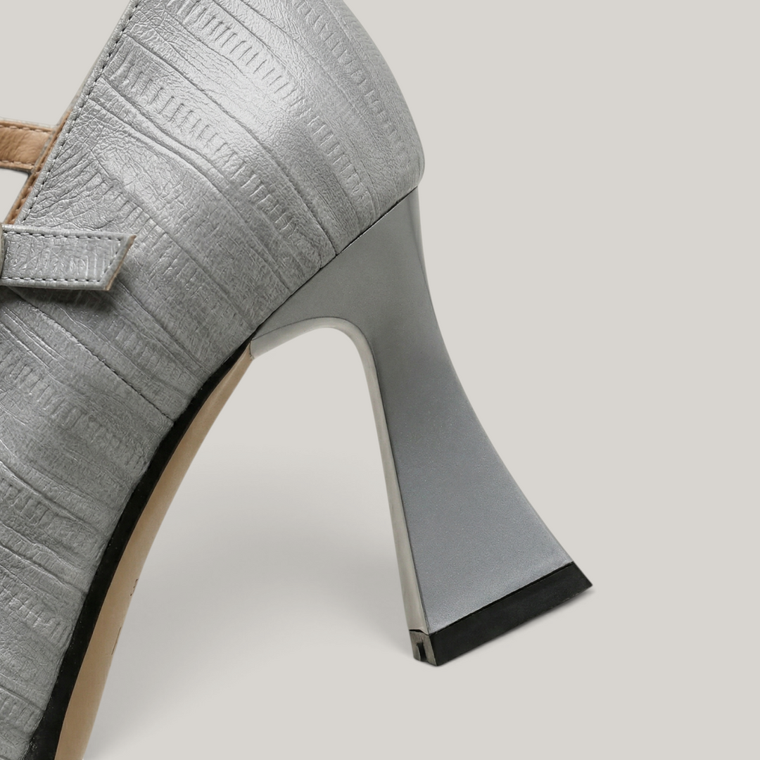 Gray high-heeled shoe on a light gray background