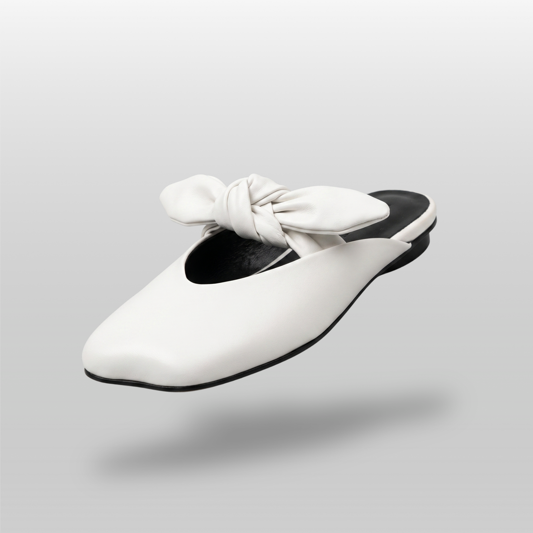 Bianca Knot Mule in Bianco Latte front view with sculptural 3D leather knot and soft square toe
