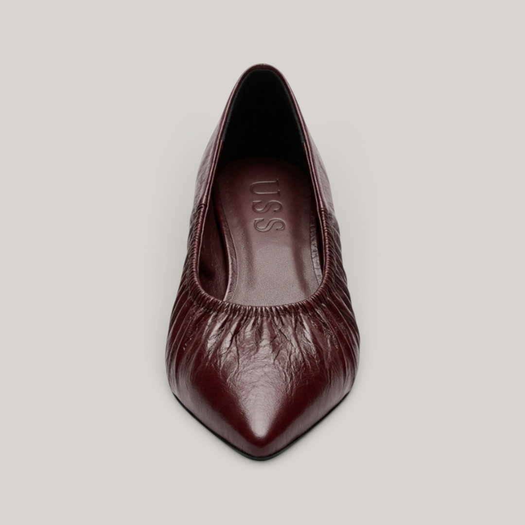 USS® Shoes Colette flat in bordeaux profond crinkled patent leather with a pointed toe and elasticated ruched topline