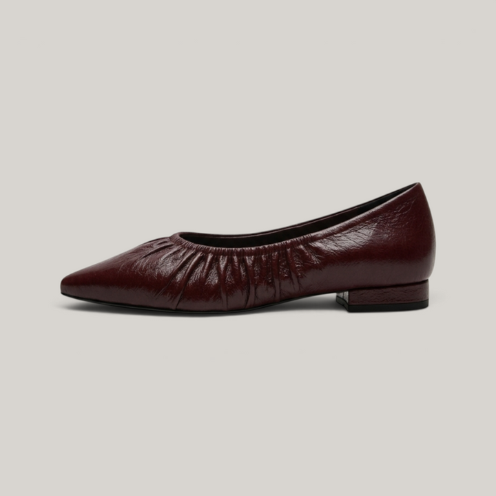 USS® Shoes Colette flat in bordeaux profond crinkled patent leather with a pointed toe and ruched elasticated topline.