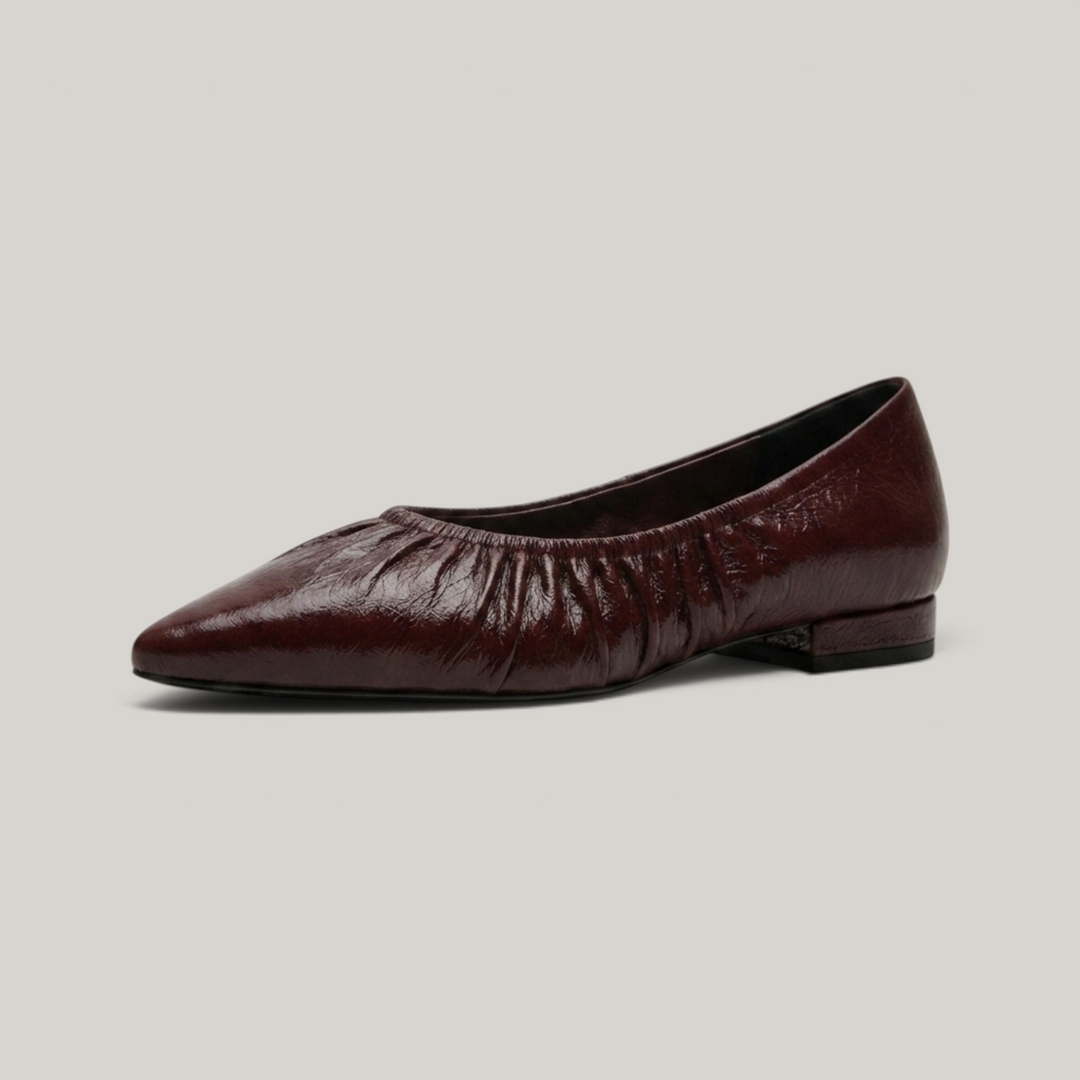 USS® Shoes Colette flat in bordeaux profond crinkled patent leather with a pointed toe and ruched elastic topline.