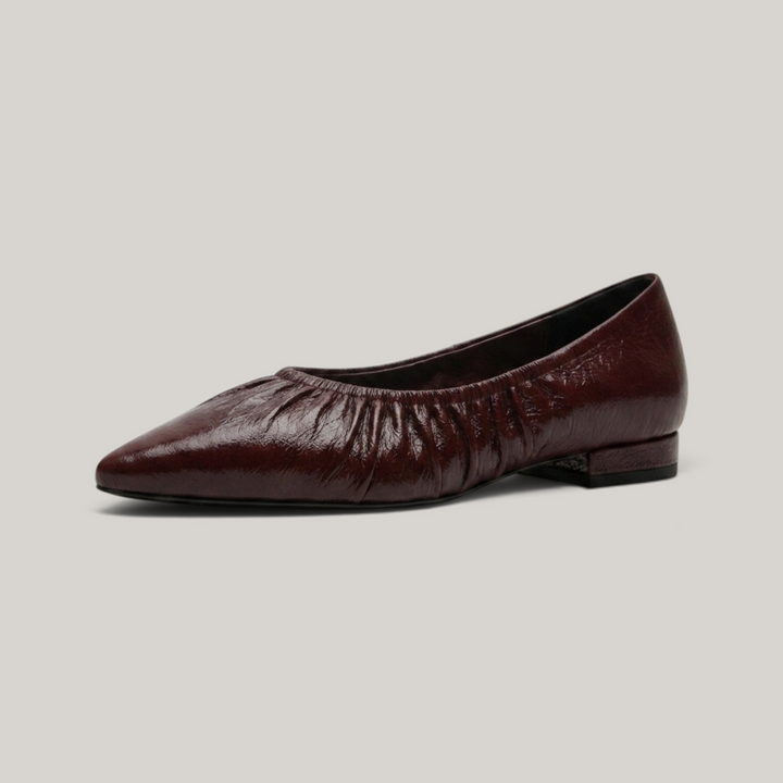USS® Shoes Colette flat in bordeaux profond crinkled patent leather with a pointed toe and ruched elastic topline.