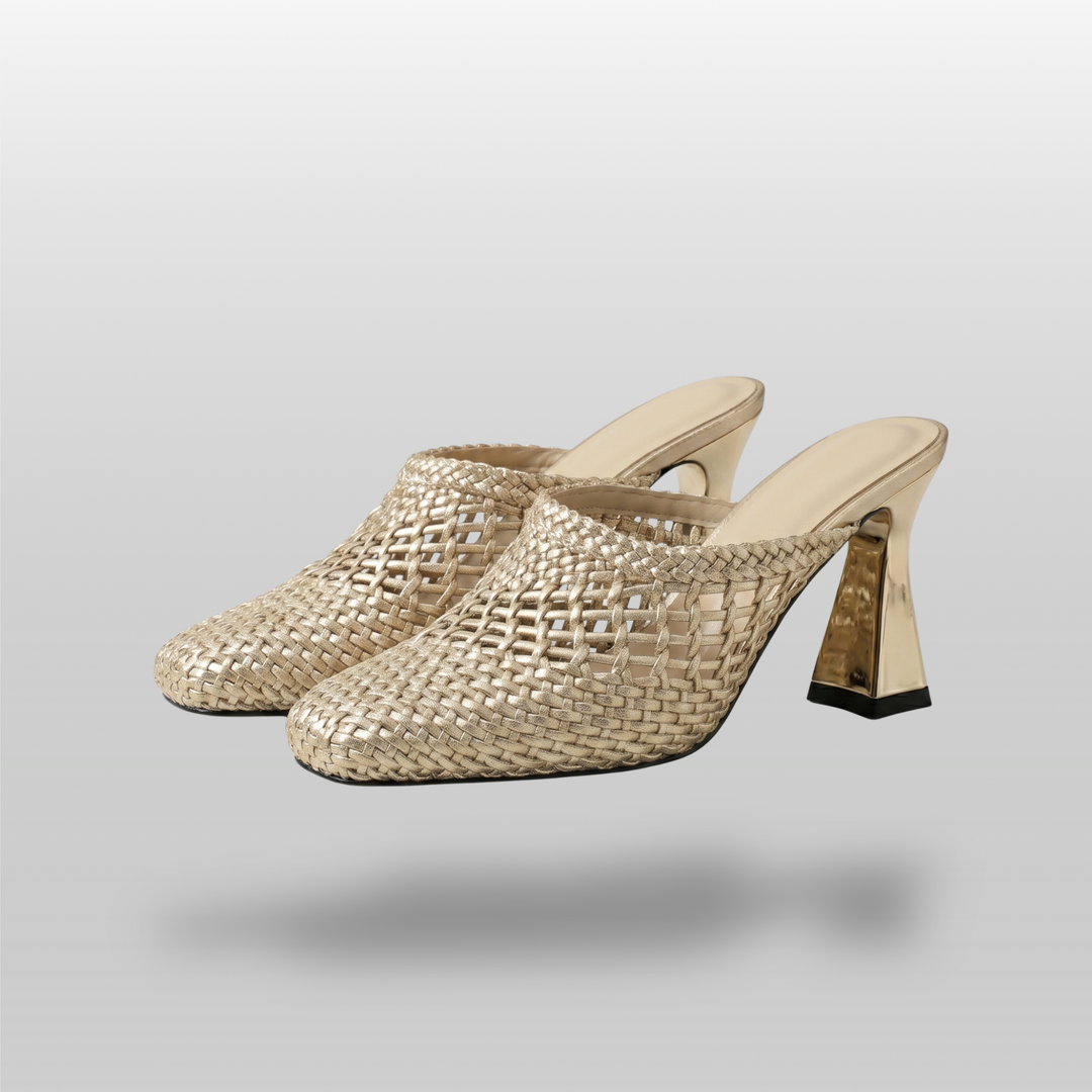 Dorée Mule in Or Tissé. Pair of metallic woven gold mules with square toe and sculptural block heel.