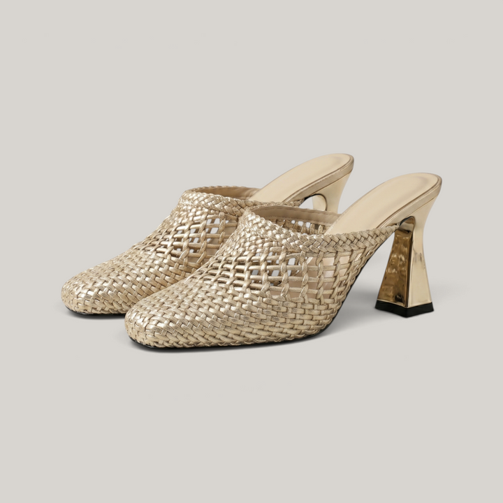 Dorée Mule in Or Tissé. Pair of metallic woven gold mules with square toe and sculptural block heel.
