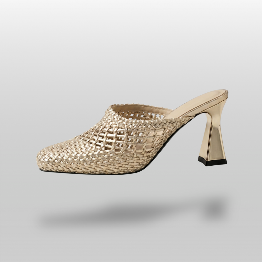 Dorée Mule in Or Tissé. Lateral silhouette showing the architectural trapezoidal block heel and open-mesh golden weave.