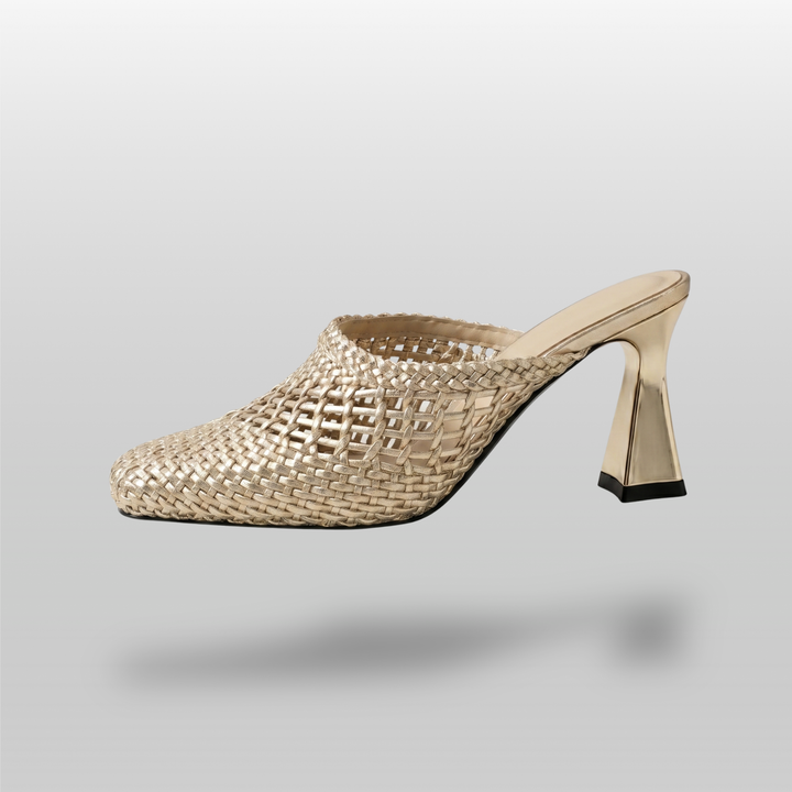 Dorée Mule in Or Tissé. Lateral silhouette showing the architectural trapezoidal block heel and open-mesh golden weave.