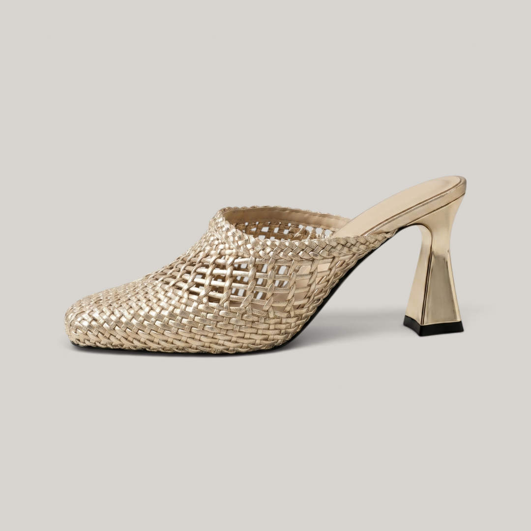 Dorée Mule in Or Tissé. Lateral silhouette showing the architectural trapezoidal block heel and open-mesh golden weave.