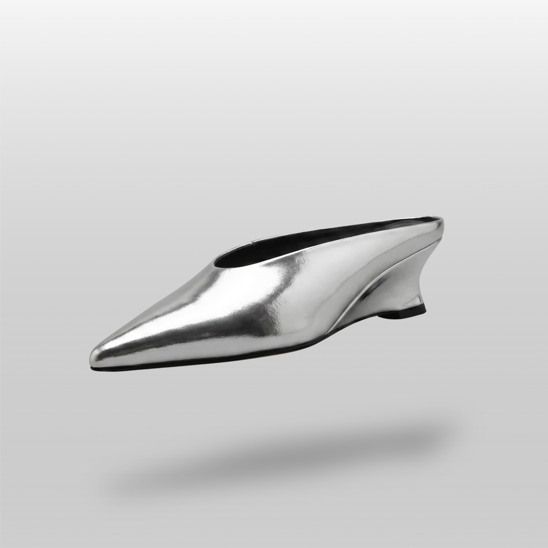 Front angled view of the elegant pointed-toe Lumière Mule shoe in a shiny silver Argent Vif finish.