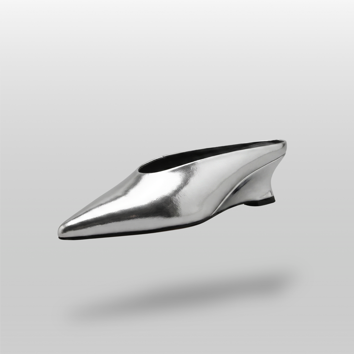 Front angled view of the elegant pointed-toe Lumière Mule shoe in a shiny silver Argent Vif finish.