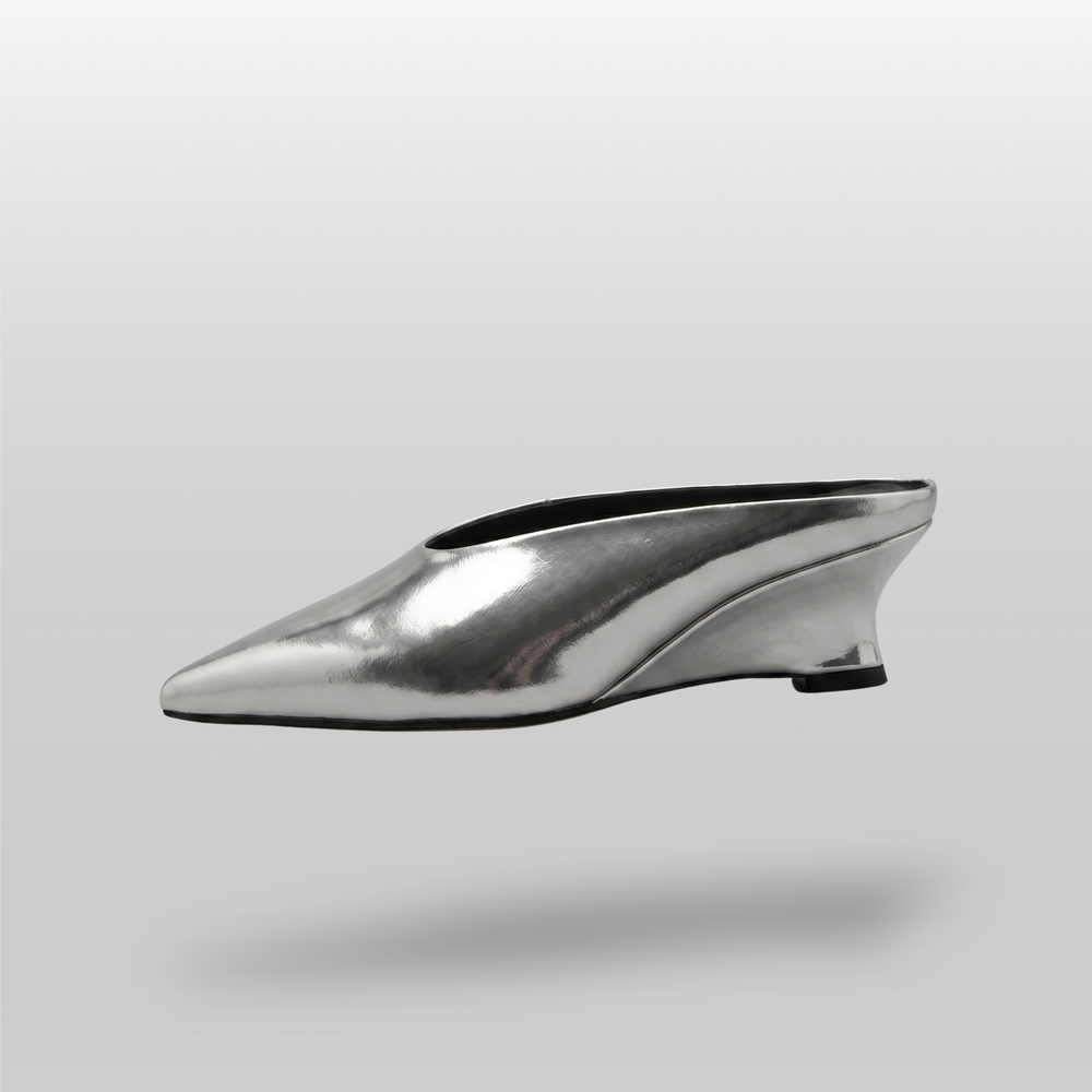 Side profile of the silver Argent Vif Lumière Mule, showcasing its sleek silhouette and geometric heel.