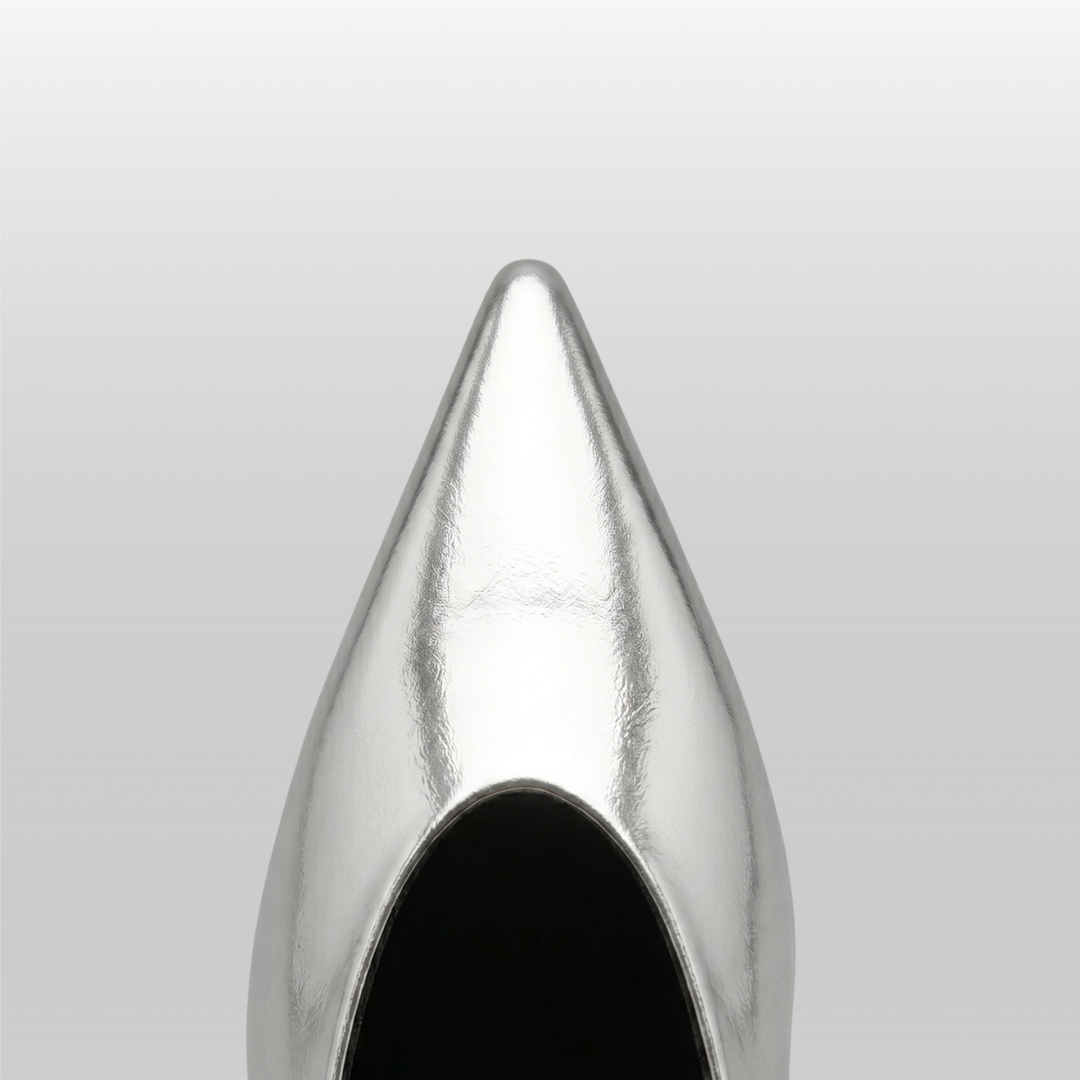 Top-down close-up of the pointed toe on the silver Argent Vif Lumière Mule in a metallic finish.
