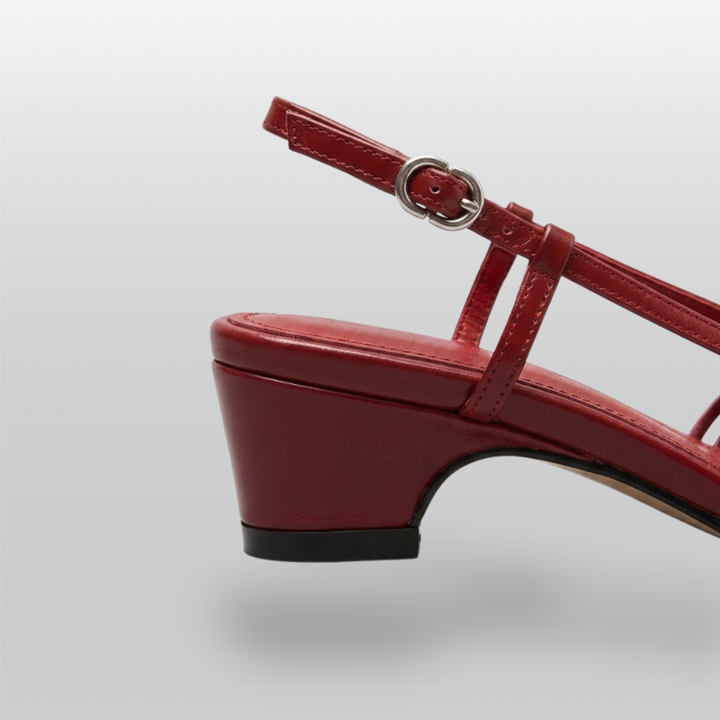 Side view close-up of the Margot Slingback in Rouge Claret, highlighting the low block heel and adjustable silver buckle strap.