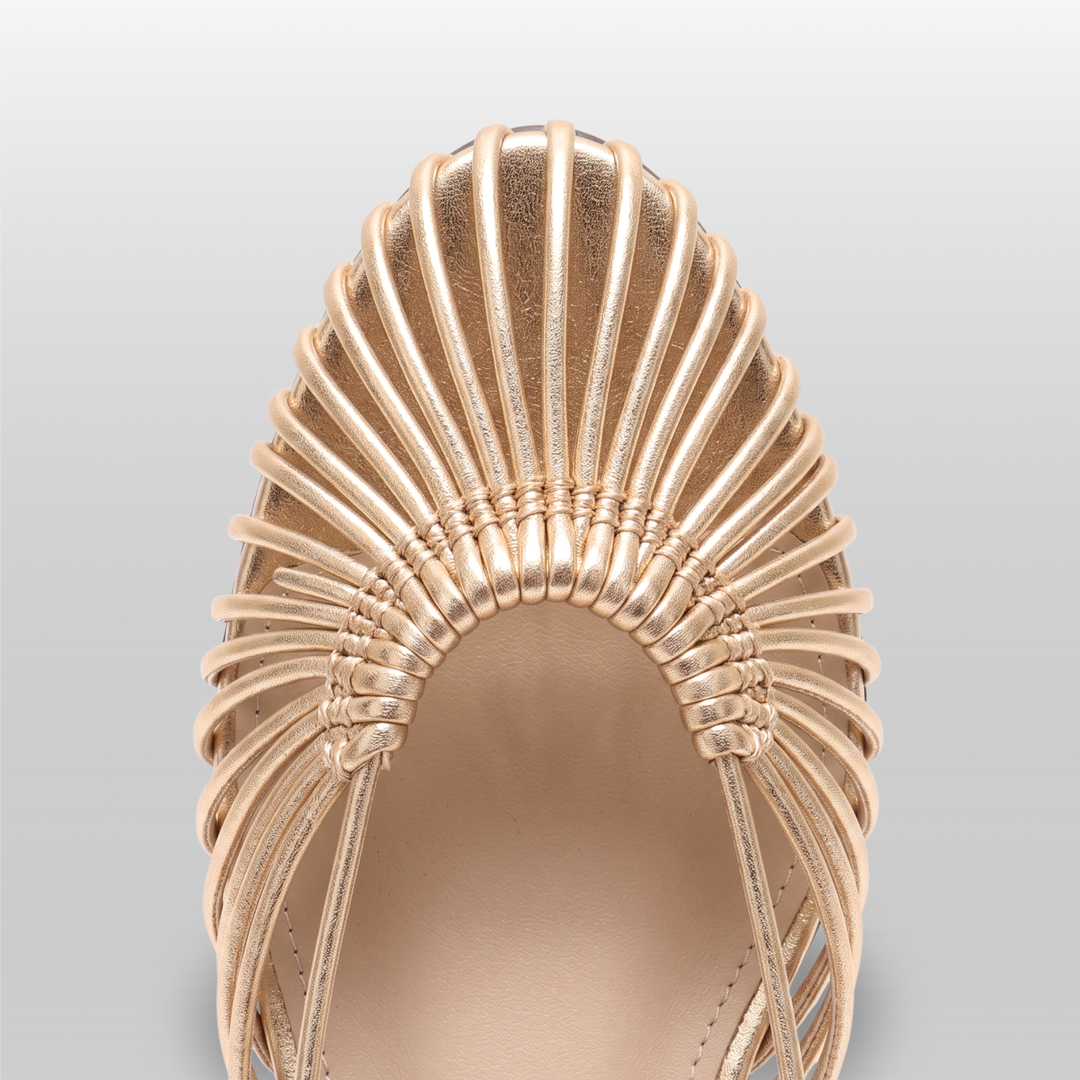Close-up of radiating woven leather cords on gold sandal vamp
