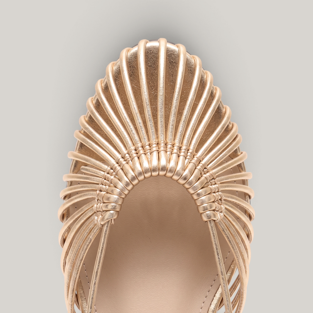 Close-up of radiating woven leather cords on gold sandal vamp