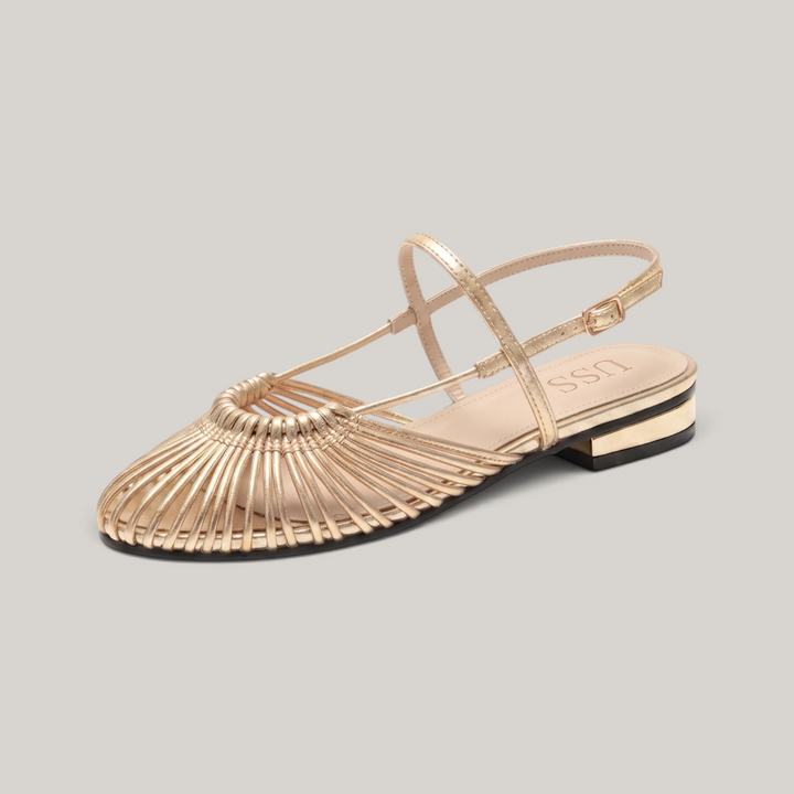 Gold woven leather flat sandal with sunburst vamp and ankle strap
