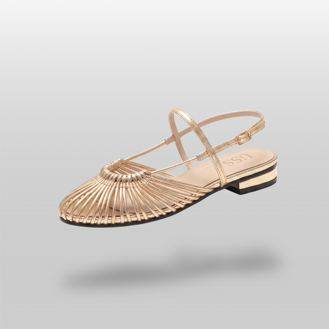 Gold woven leather flat sandal with sunburst vamp and ankle strap