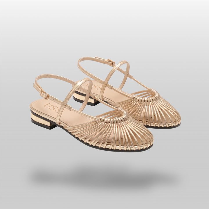 Pair of gold woven flat sandals with radiating vamp and ankle straps