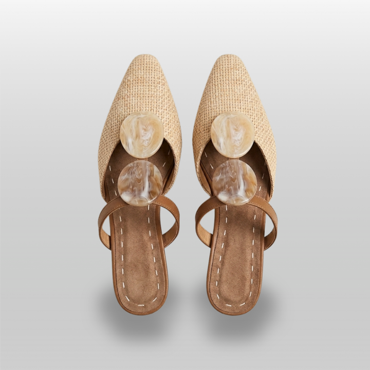 Paloma Mule in Sable Doré. Close detail of two oval resin medallions in marbled cream and caramel with natural translucency.