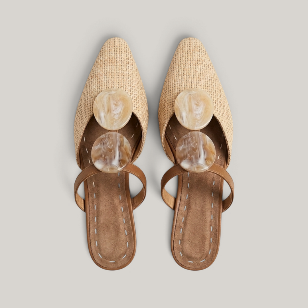 Paloma Mule in Sable Doré. Close detail of two oval resin medallions in marbled cream and caramel with natural translucency.