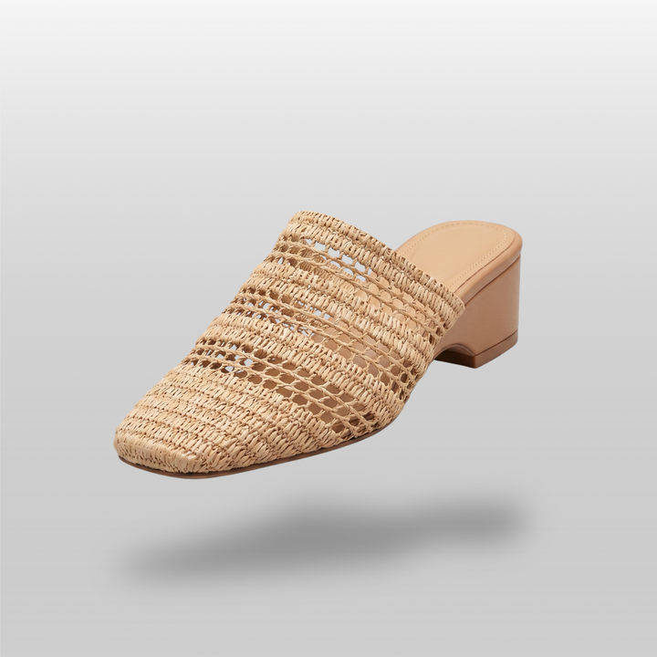 Riviera Mule in Sable Naturel. A natural raffia woven square toe mule with a structured block heel