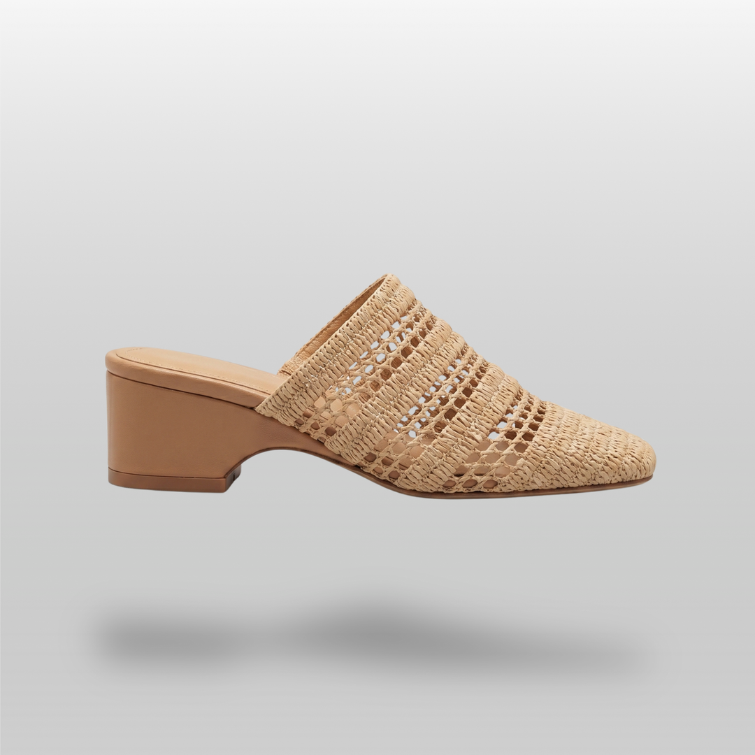 Side view of the Riviera Mule in Sable Naturel, featuring an open raffia weave, square toe silhouette, and a 6cm block heel.