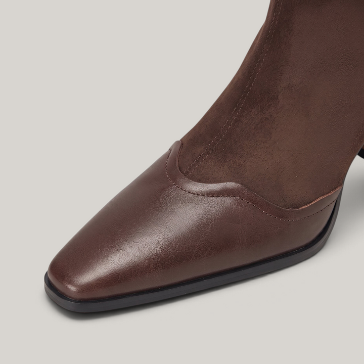 Elongated square toe of the Romy Bootie in smooth Brun Noisette cowhide with a soft wave seam at the instep