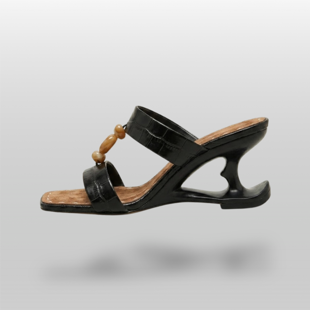 Sculpture Sandal in Noir Croco. Architectural negative-space heel in structured black leather.
