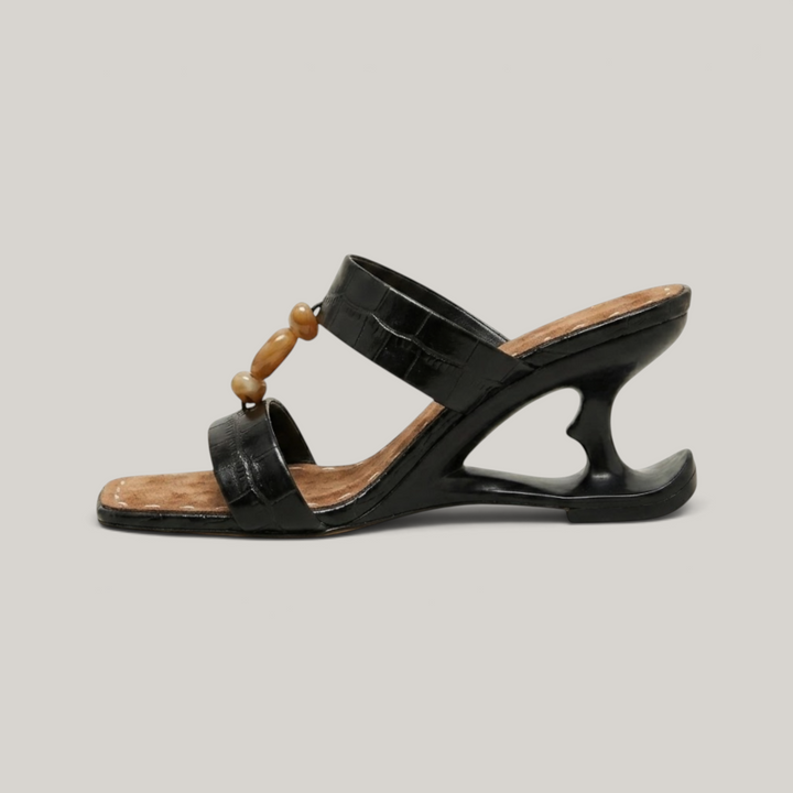 Sculpture Sandal in Noir Croco. Architectural negative-space heel in structured black leather.
