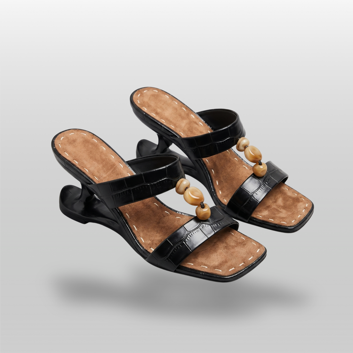 Sculpture Sandal in Noir Croco. Pair of crocodile-embossed sandals with amber bead vamp detail.
