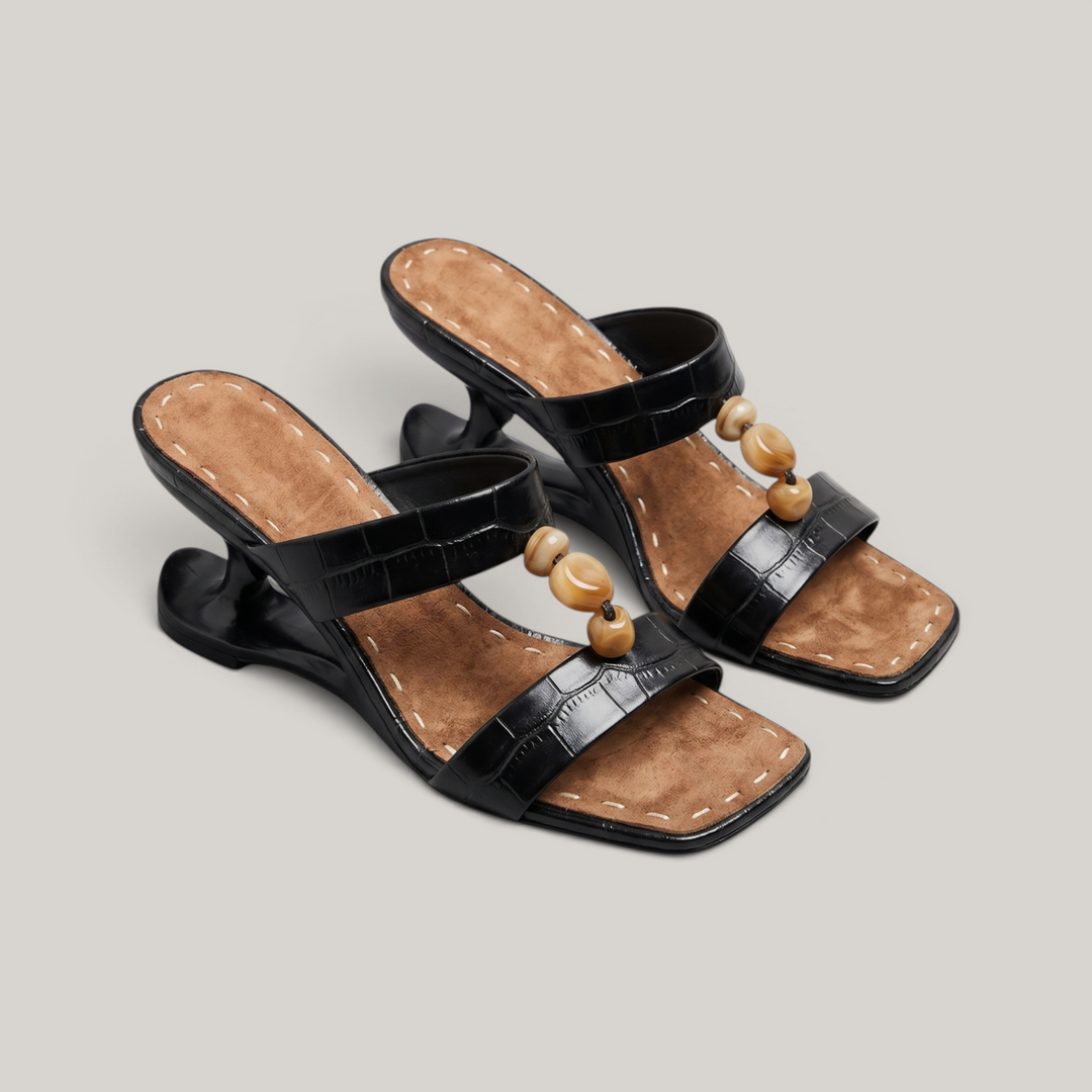 Sculpture Sandal in Noir Croco. Pair of crocodile-embossed sandals with amber bead vamp detail.