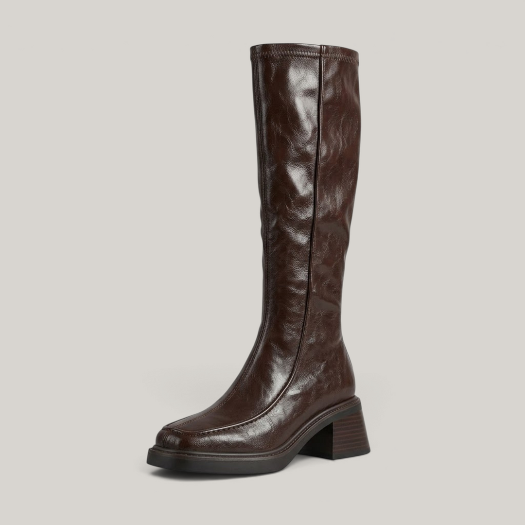 Brown knee-high stretch boot with moc-toe seam and stacked block heel