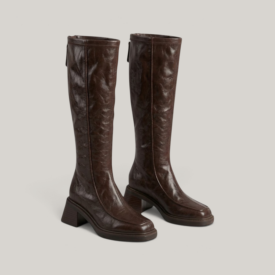 Pair of brown knee-high stretch boots with stacked block heels