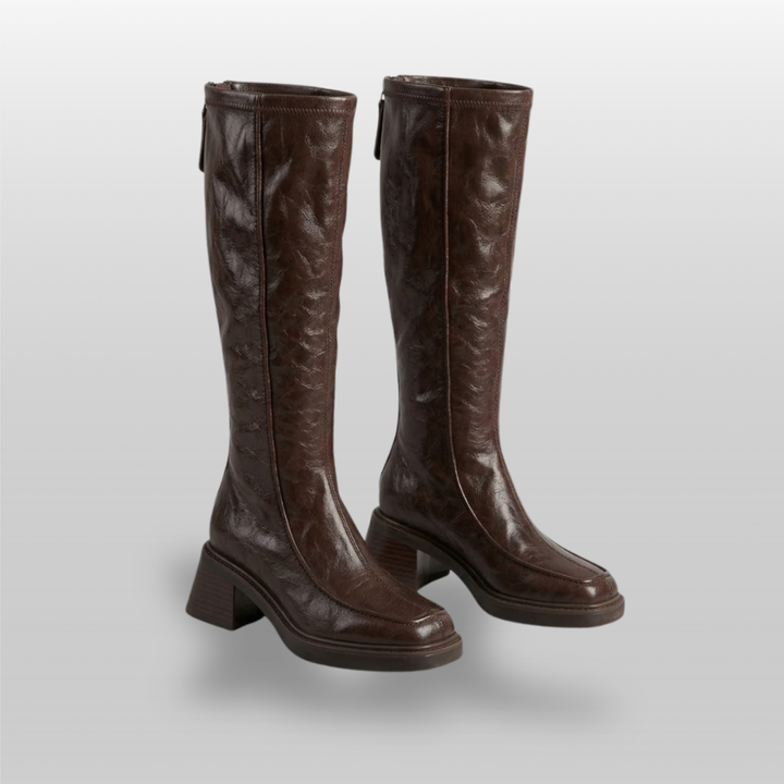 Pair of brown knee-high stretch boots with stacked block heels