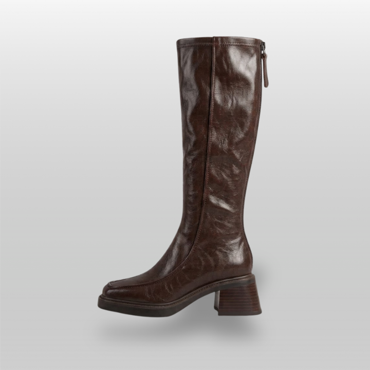 Side profile of brown knee-high boot showing full-length back zip
