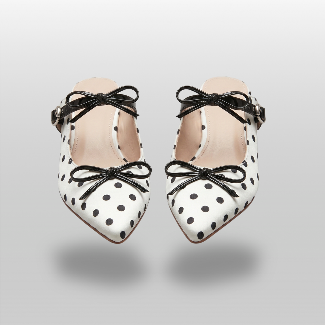 Pair of USS Elise Pointed Mules, a modern luxury take on classic polka dot summer footwear, featuring premium sheepskin lining.