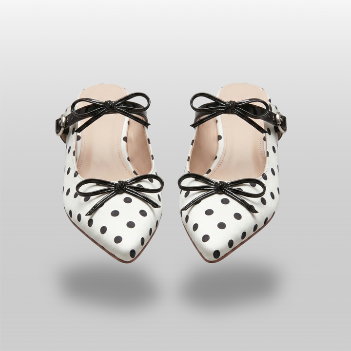 Pair of USS Elise Pointed Mules, a modern luxury take on classic polka dot summer footwear, featuring premium sheepskin lining.