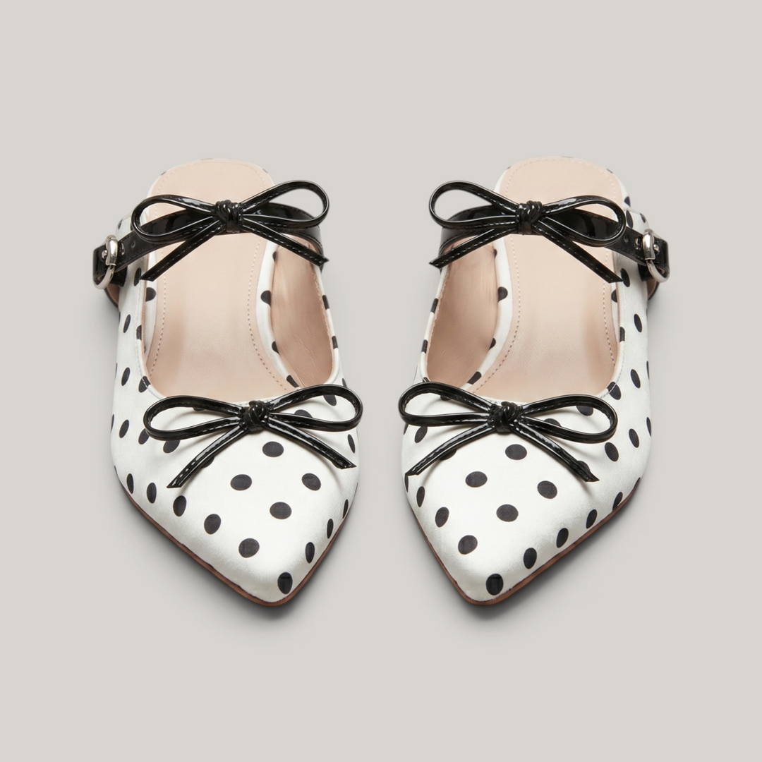 Pair of USS Elise Pointed Mules, a modern luxury take on classic polka dot summer footwear, featuring premium sheepskin lining.