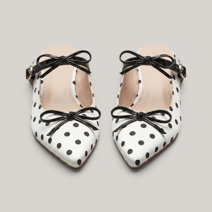 Pair of USS Elise Pointed Mules, a modern luxury take on classic polka dot summer footwear, featuring premium sheepskin lining.