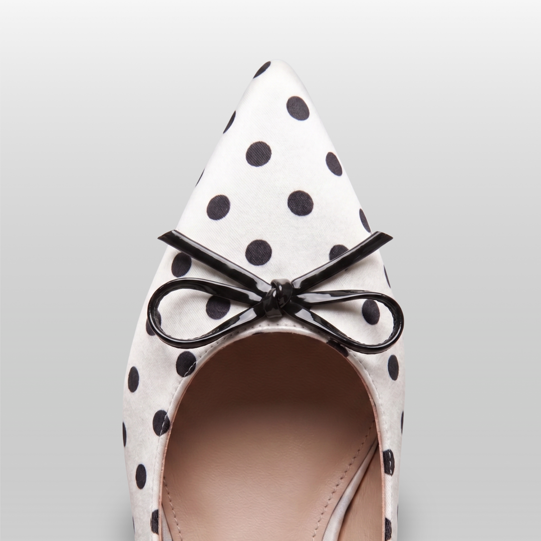 Close-up detail of the USS Elise pointed toe box, highlighting the high-quality leather grain and precision polka dot print.