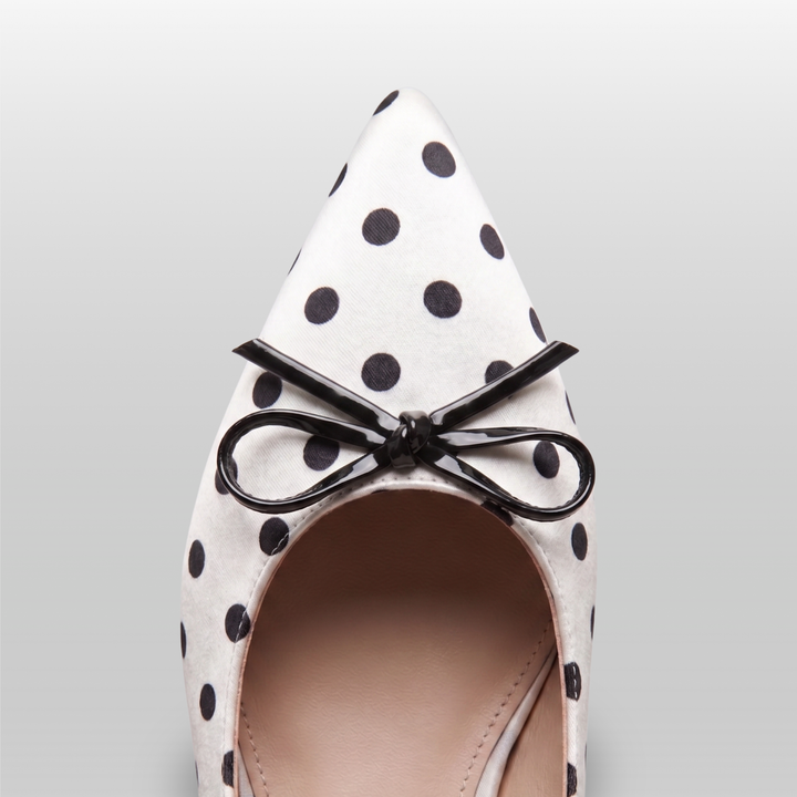 Close-up detail of the USS Elise pointed toe box, highlighting the high-quality leather grain and precision polka dot print.
