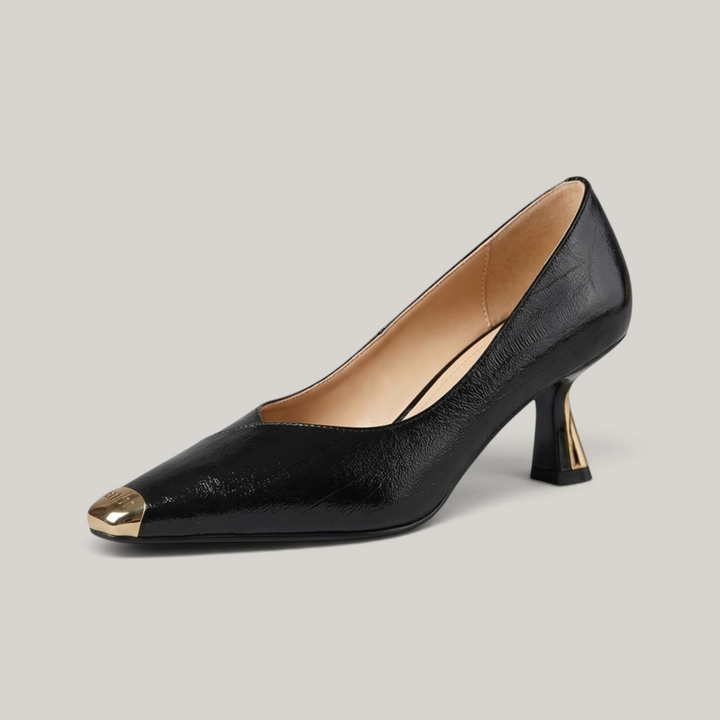USS® Shoes Aurelle black sheepskin leather pumps with a sculpted heel and metallic pointed toe detail.