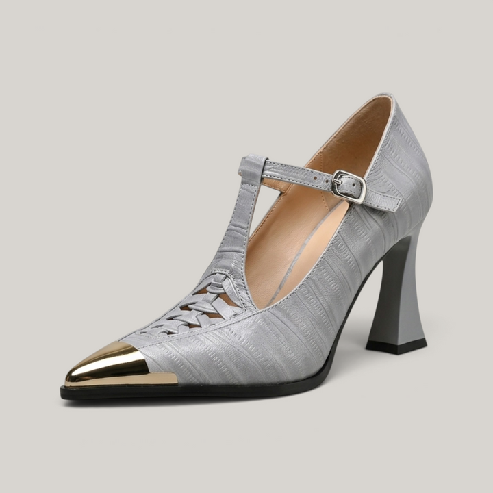 USS® Shoes Aveline sculpted pumps in grey textured leather with a metallic pointed toe and t-strap buckle closure.