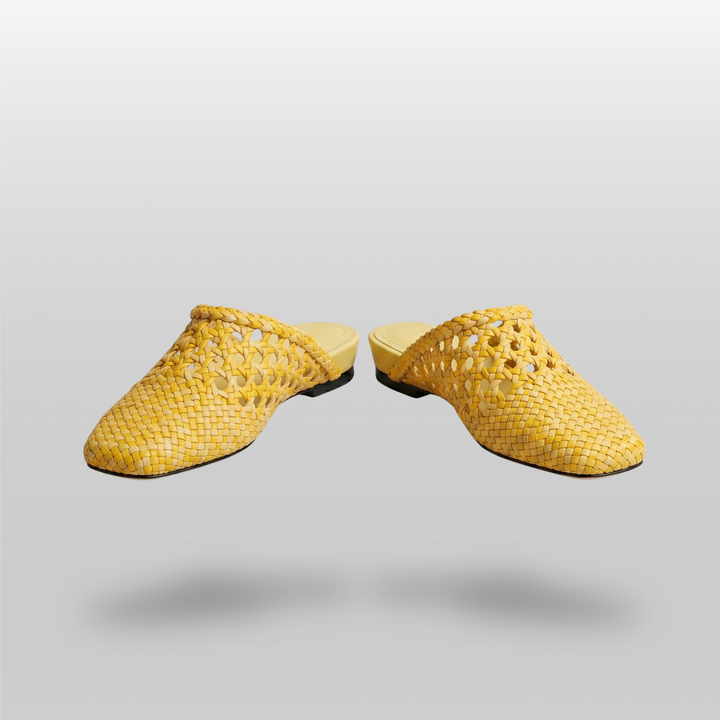 A pair of USS Sienna Soleil Yellow mules, minimalist Mediterranean style women&