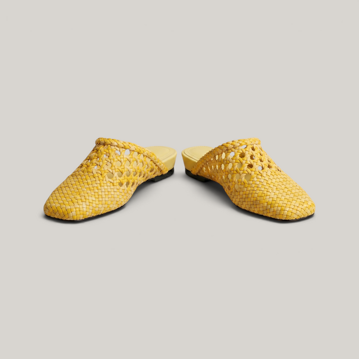 A pair of USS Sienna Soleil Yellow mules, minimalist Mediterranean style women&