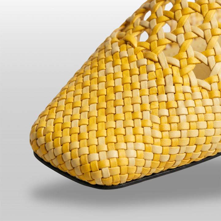 Extreme close-up of the hand-woven leather texture on the USS Sienna Mule, showcasing the square toe and artisanal craftsmanship.