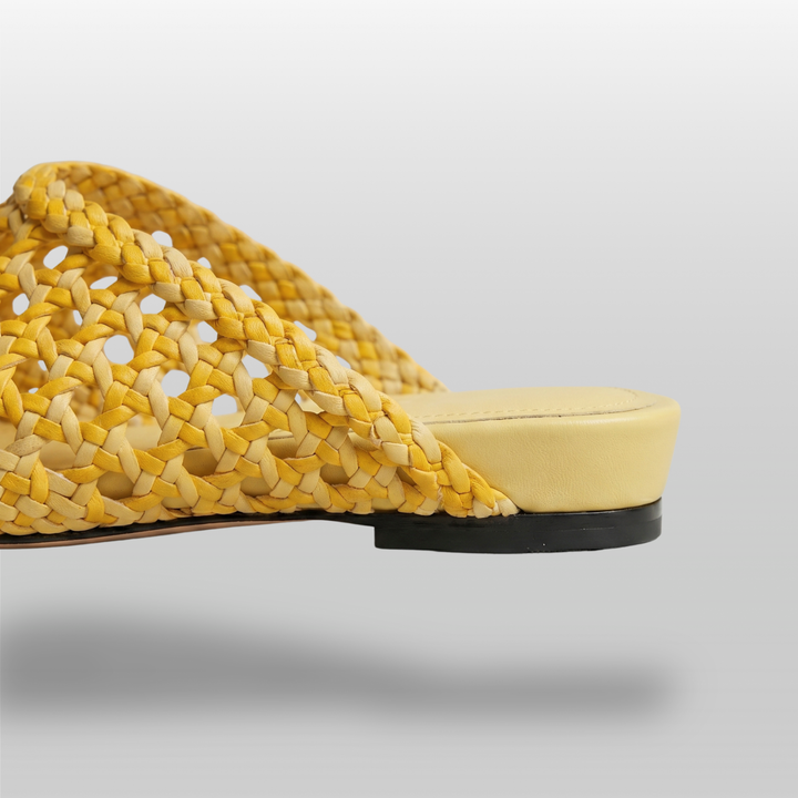 Detailed view of the premium leather insole and heel construction of the USS Sienna Mule in Soleil Yellow.