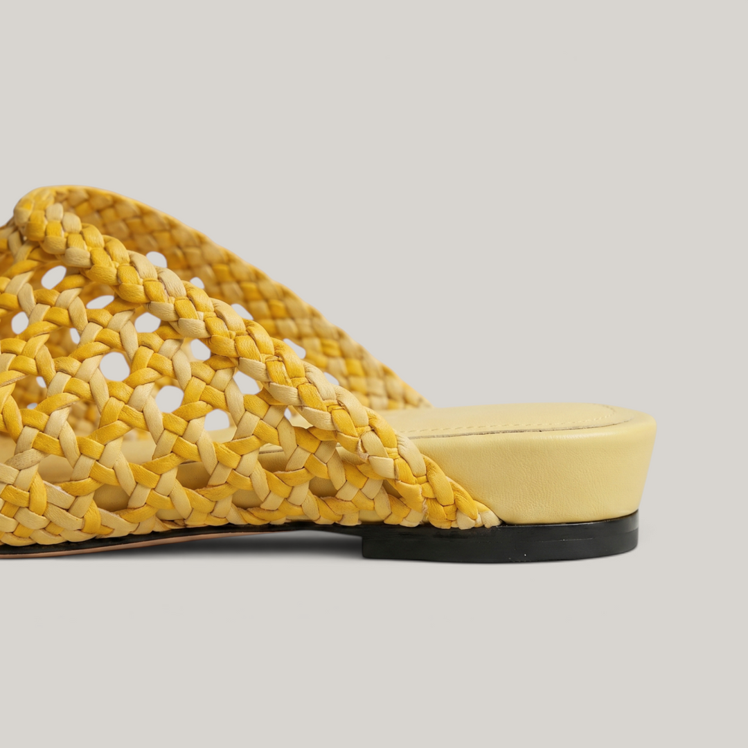 Detailed view of the premium leather insole and heel construction of the USS Sienna Mule in Soleil Yellow.
